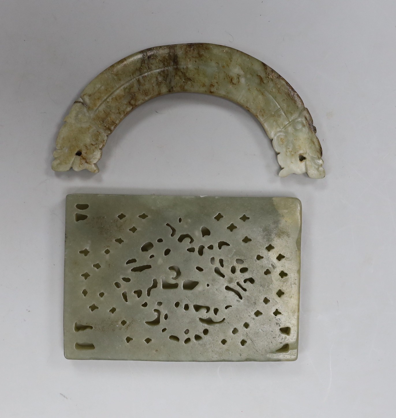 A Chinese jade rectangular plaque and a jade huang pendant, width 9cm (2)